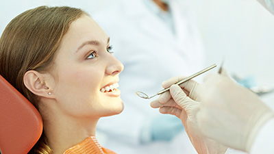 Woman receiving dental exam