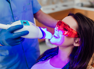 Dental patient getting her teeth professionally whitened