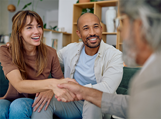 Man shaking hands with a woman