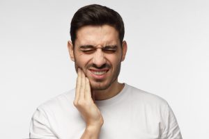 man with jaw pain