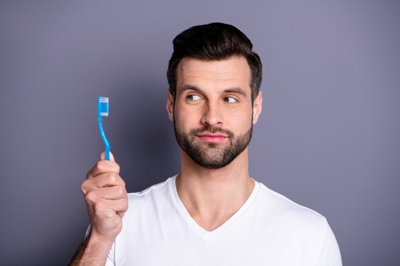 Man holding toothbrush