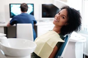 Woman smiling in dental chair during dental checkup