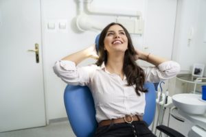 Woman smiling after getting treatment for gum disease