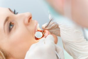 Close-up side view of patient’s face during her dental checkup