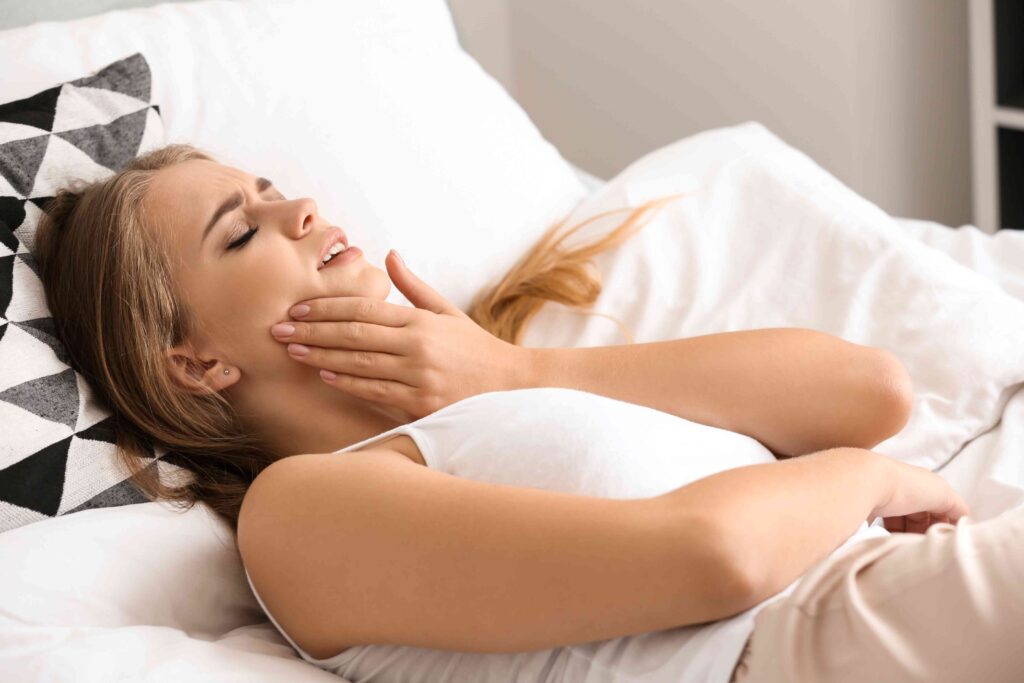 Woman with jaw pain