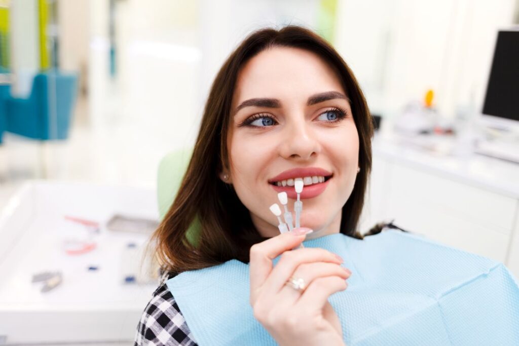 A woman getting veneers at the dentist.